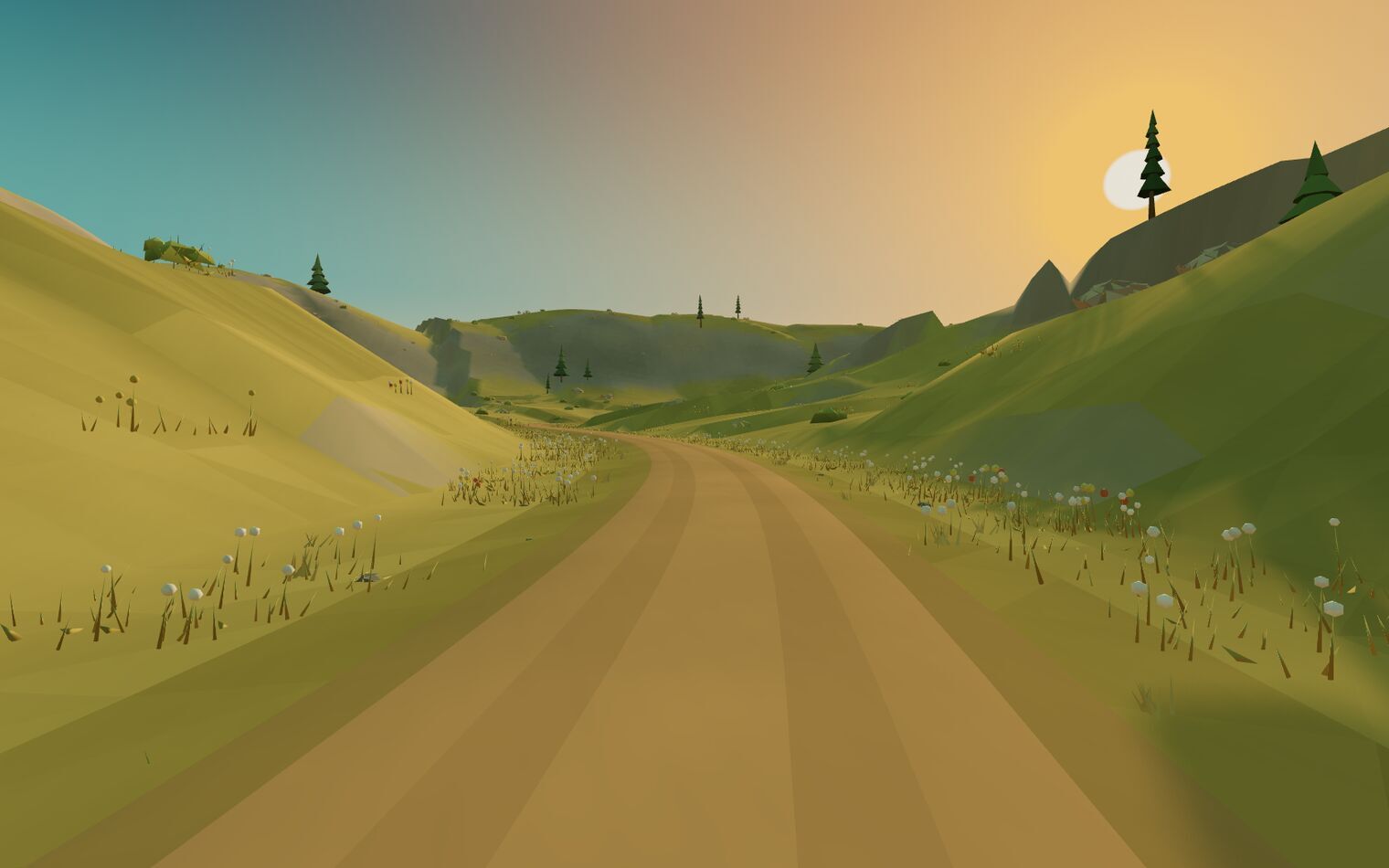 A dirt road climbs towards a grassy pass, the low sun raking across the slopes.